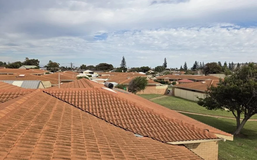 Freshly repointed terracotta tile roofs after a full restoration