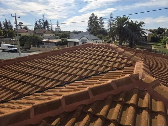 Close view of repointed ridge capping on a village roof