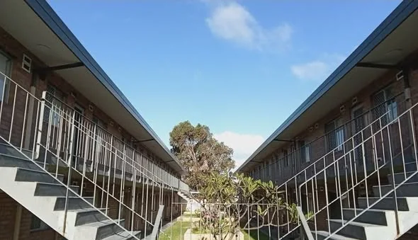 Walkway between two unit blocks showing the new eave lines