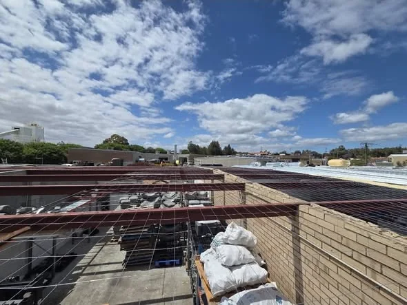 Open roof framing before new sheeting is installed