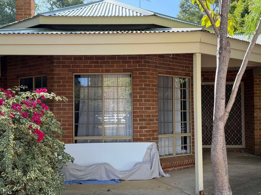 Completed patio roof on a brick home
